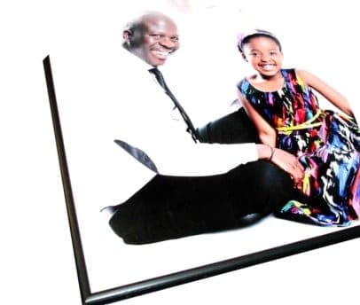 A photo block mounting of a black-and-white family photo, showing the clean, borderless display from an angle.