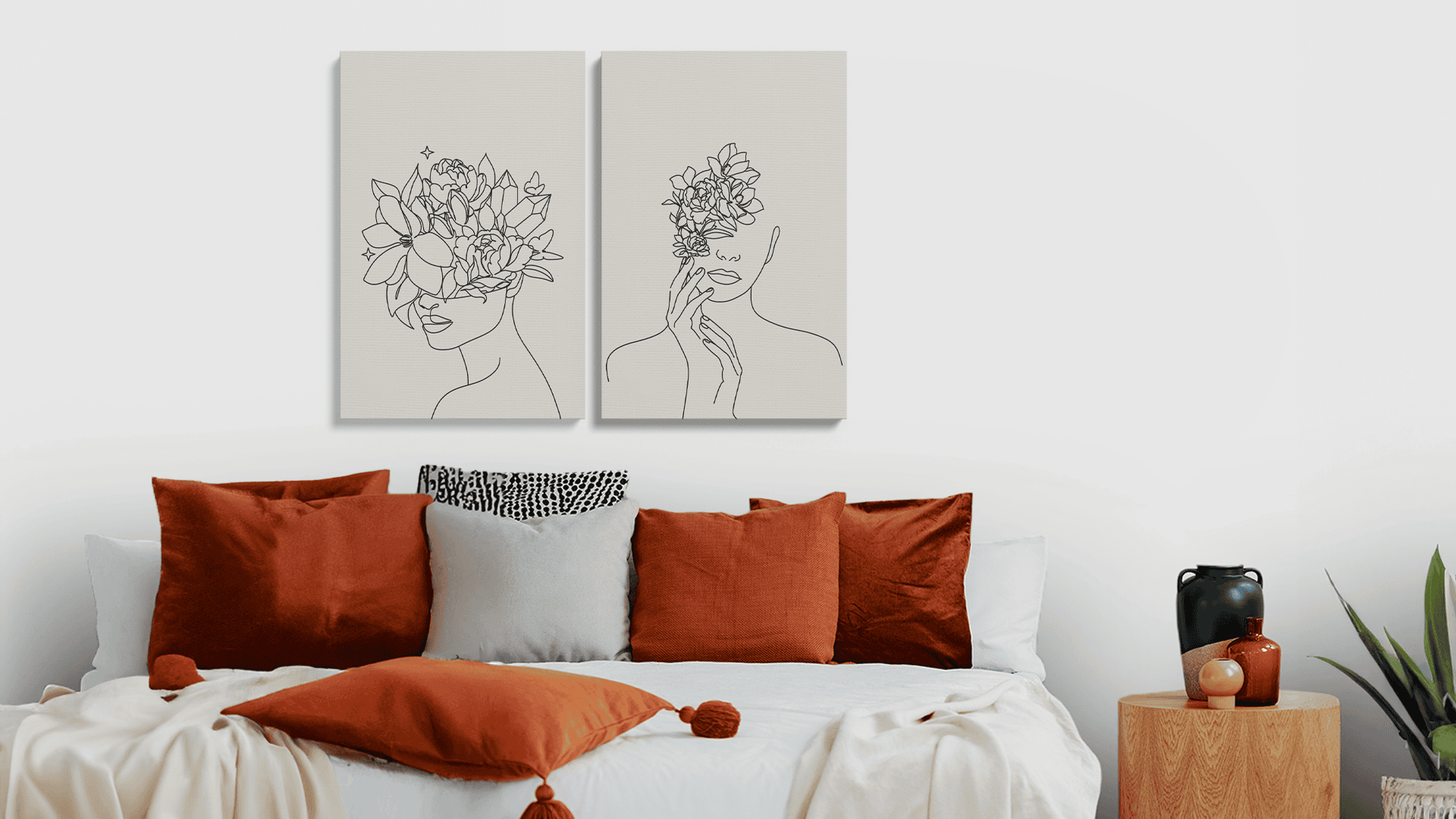 Minimal Portrait Line Art Duo I Canvas Print Set displayed above a modern bed with earthy tones